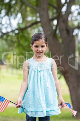 Little girl waving american flag