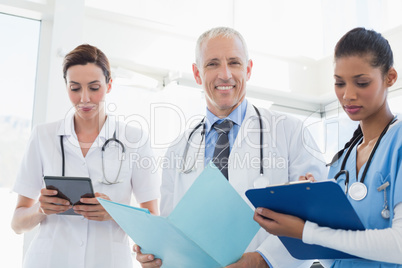 Doctors working together on patients file