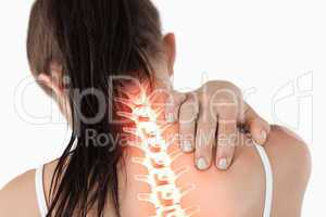 Highlighted spine of woman with neck pain