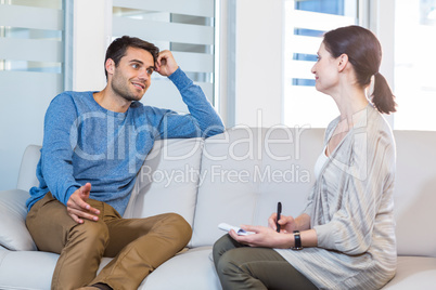 Psychologist talking with happy man