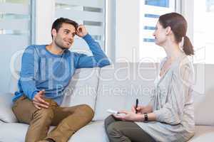 Psychologist talking with happy man