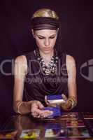 Fortune teller forecasting the future with tarot cards