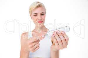 Woman doing test with blood glucose monitor