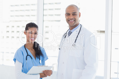 Smiling doctors looking at camera Smiling doctors looking at camera