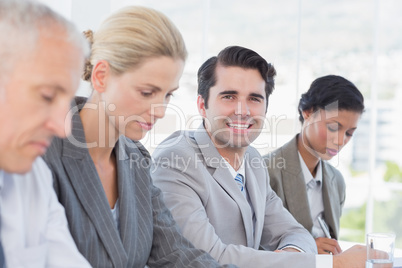 Business team taking notes during conference