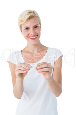 Attractive blonde woman snapping cigarette
