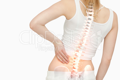 Highlighted spine of woman with back pain