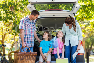 Happy family getting ready for road trip