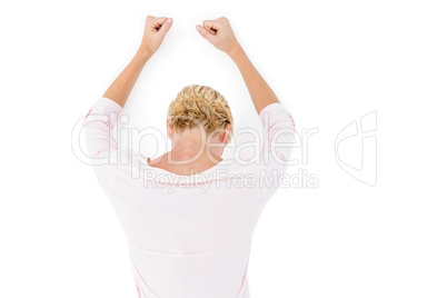 Nervous blonde woman leaning against the wall