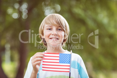 Young boy holding an american flag