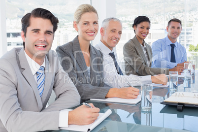 Business team taking notes during conference