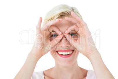 Smiling blonde woman doing funny face