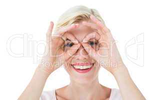 Smiling blonde woman doing funny face