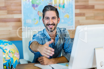 Smiling travel agent presenting his hand