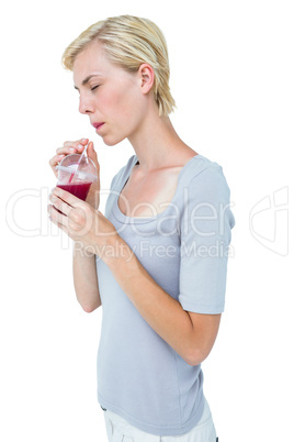 Attractive woman drinking healthy juice