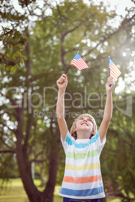 Young boy holding an american flag