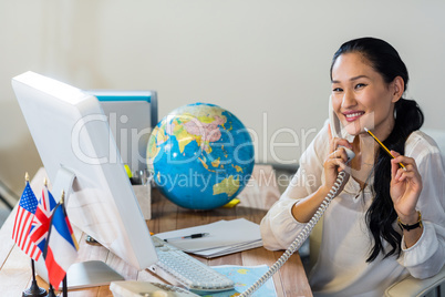Pretty businesswoman having phone call
