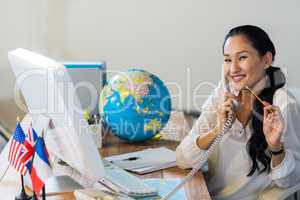 Pretty businesswoman having phone call