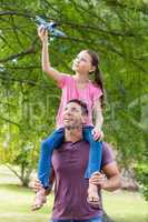 Father and daughter having fun in the park