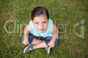 Little girl looking up at camera