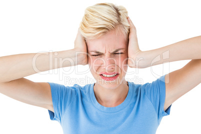 Furious blonde woman holding her head