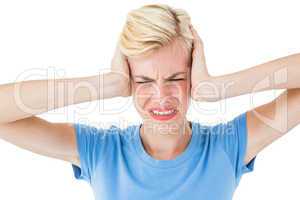 Furious blonde woman holding her head