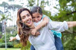 mother and daughter having fun in the park