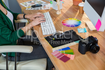 Designer typing on keyboard