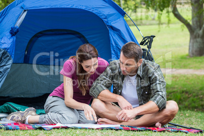 Happy couple smilling in park