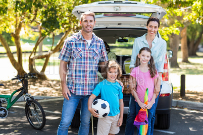 Happy family getting ready for road trip