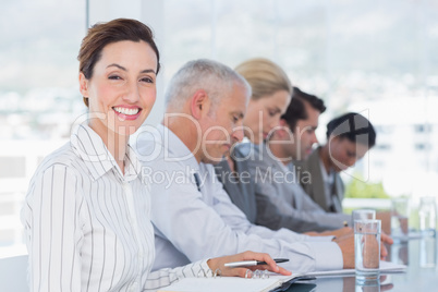 Business team taking notes during conference