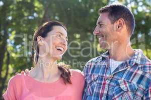 Happy couple smilling in park