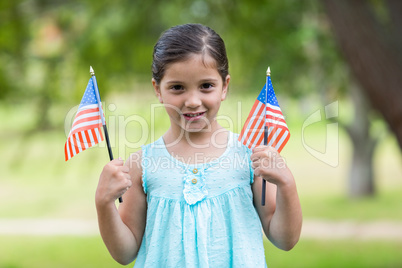 Little girl waving american flag