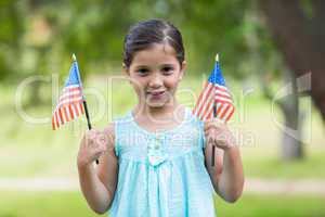 Little girl waving american flag