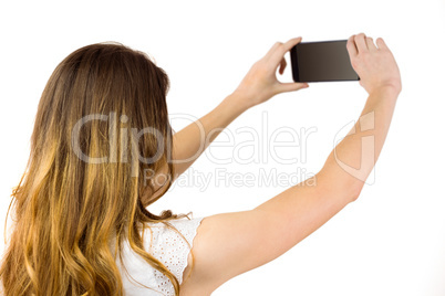 Woman taking a selfie on smartphone