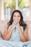 Pretty brunette relaxing on the couch