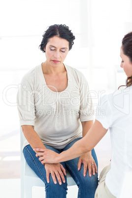 Hypnotized woman with her therapist