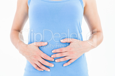 Woman touching her painful stomach