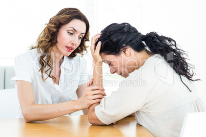 Therapist comforting her patient