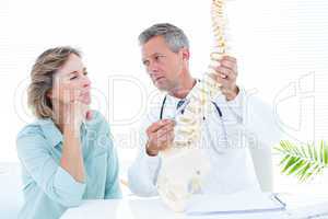 Doctor pointing anatomical spine