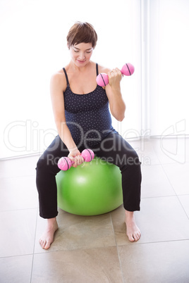 Pregnant woman keeping in shape