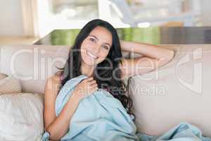 Pretty brunette relaxing on the couch