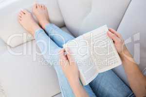 Woman reading on couch