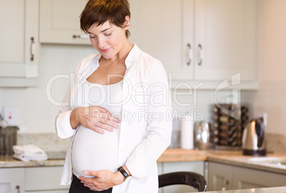 Pregnant woman holding her bump