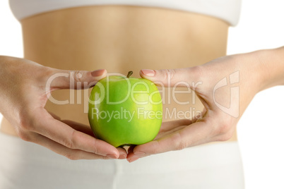 Slim woman holding green apple