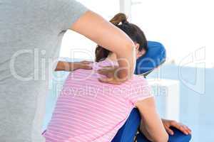 Woman having shoulders massage