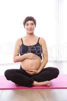 Pregnant woman keeping in shape