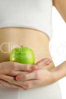 Slim woman holding green apple