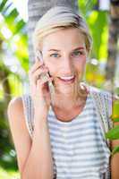 Pretty blonde woman calling on the phone