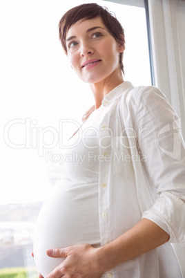 Pregnant woman holding her bump